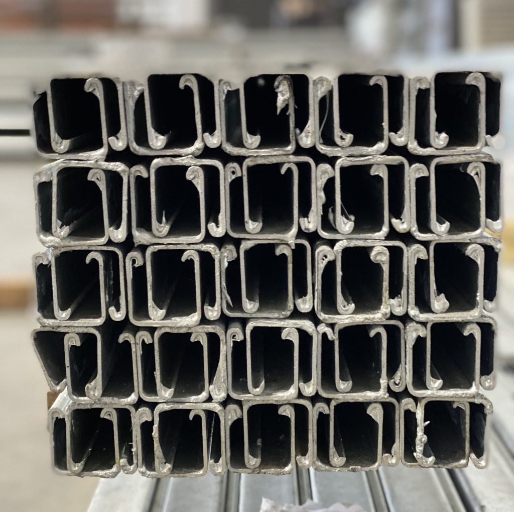 Voltecx products: Steel C-channels used in cable management systems.